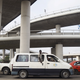 A commuter van drives underneath the newly constructed Henri Konan Bedie bridge in Abidjan.